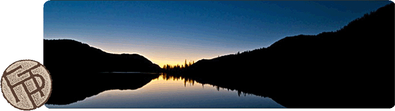 Reflective Lake at Sunrise